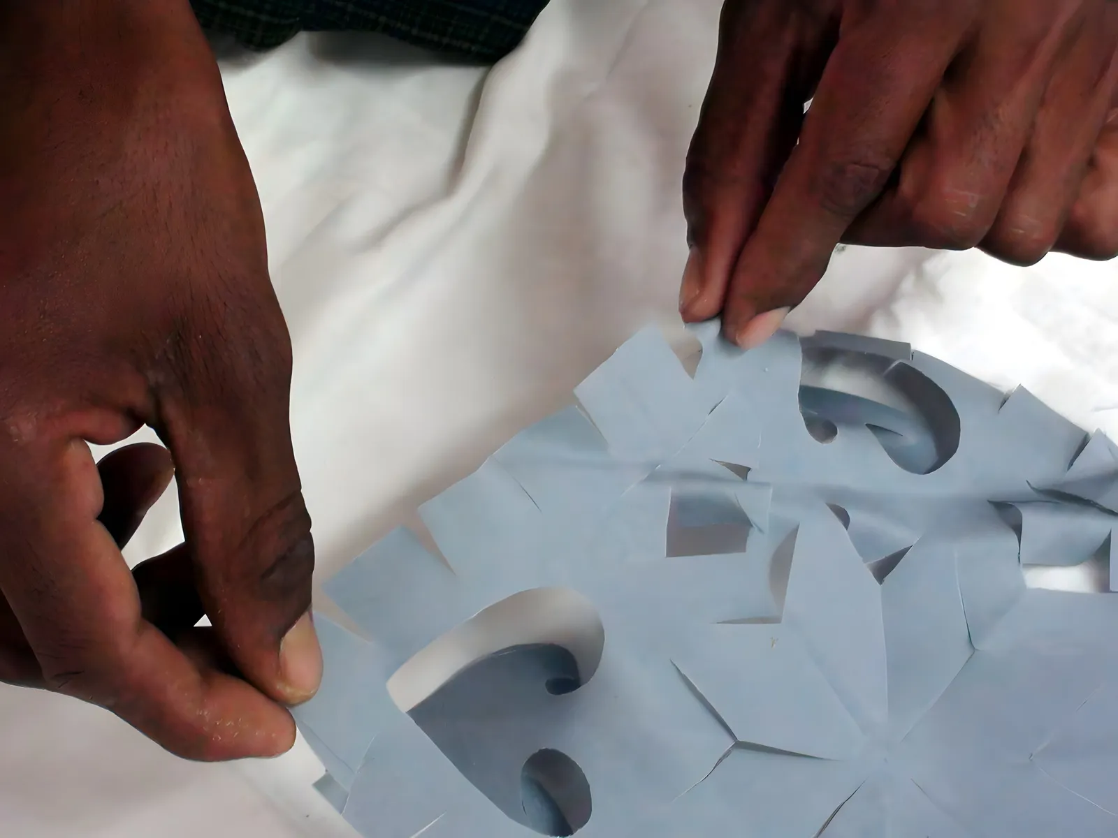 Placing appliqué pieces on the ground cloth
