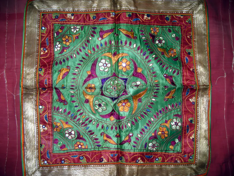 Embroidered square with gold border