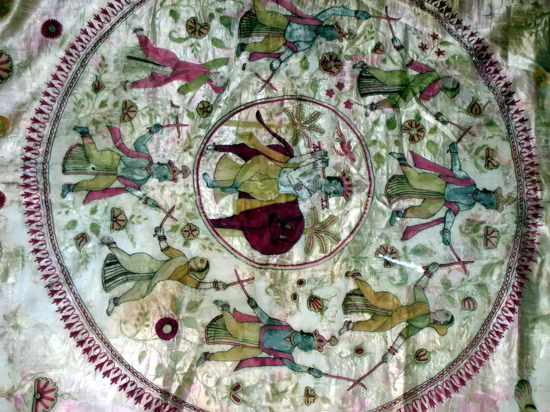 Mochi embroidery, figures in medallion