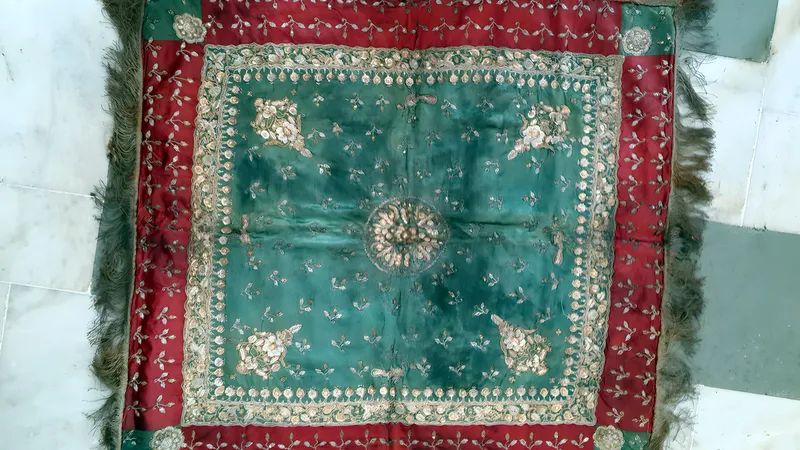 Embroidered square with red border