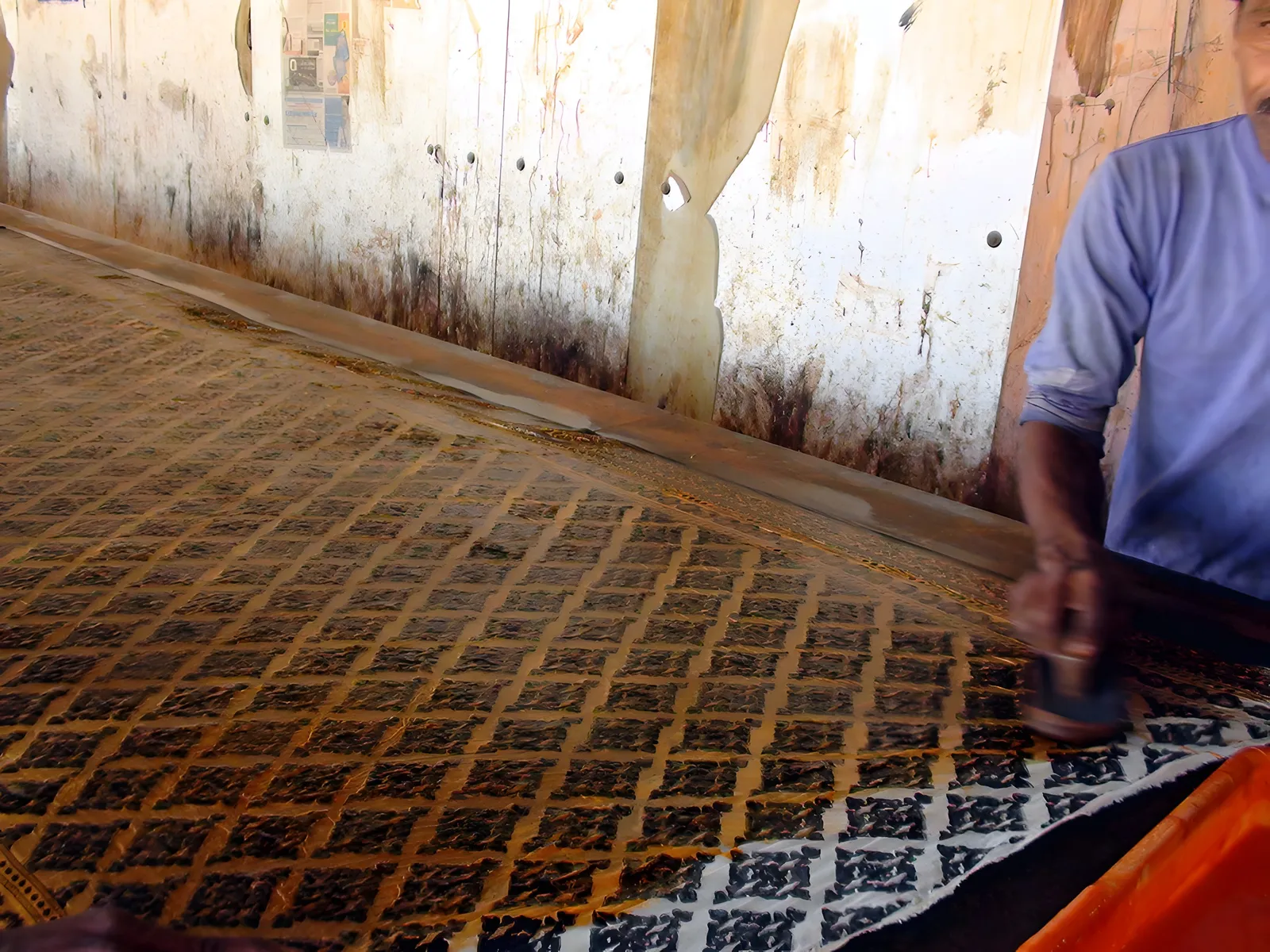 A mustard-and-madder block print, drying