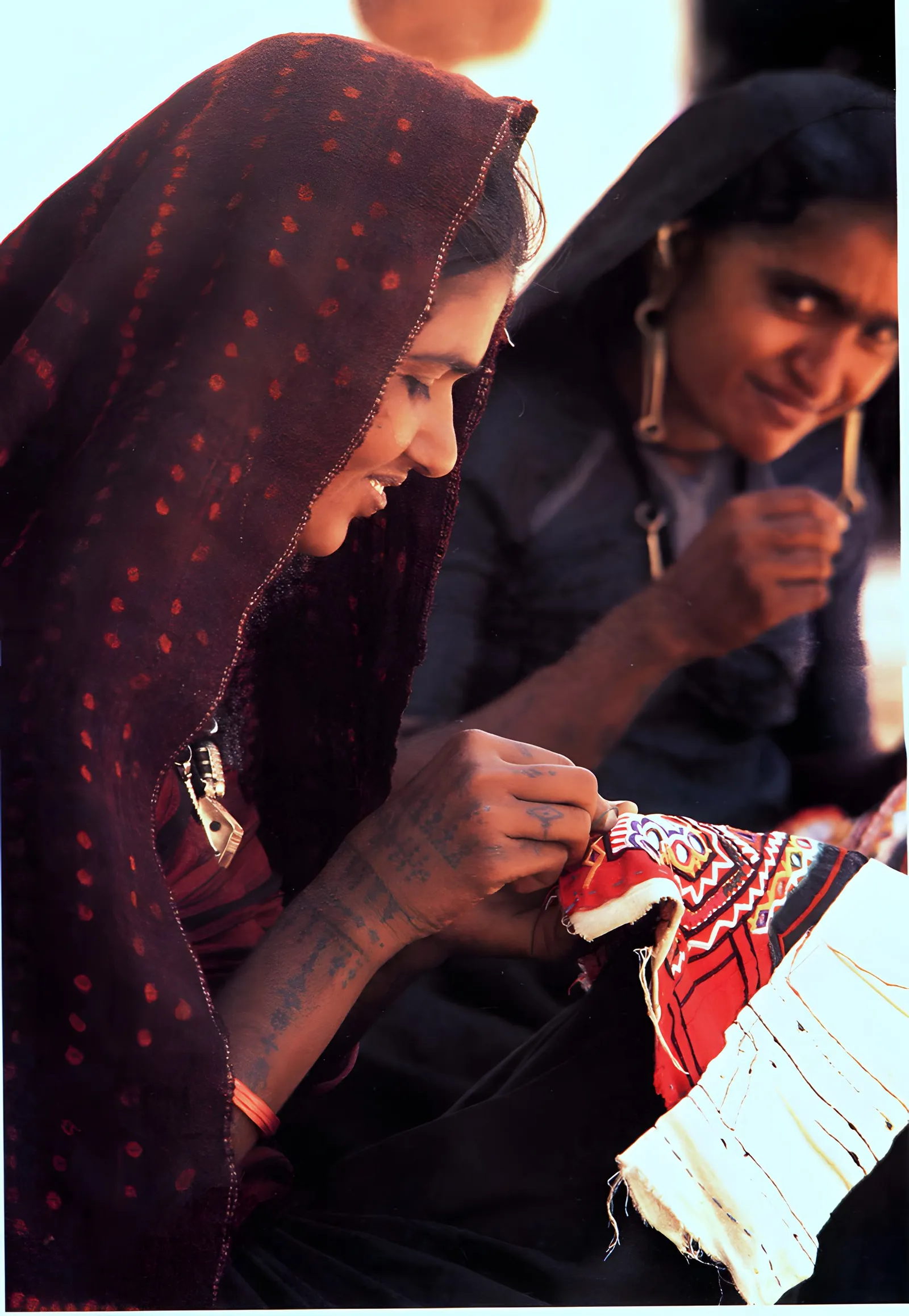 Two embroiderers at work