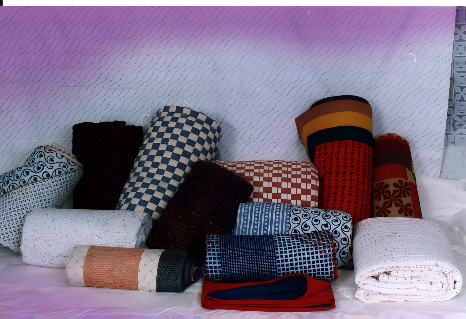Rolled hand-quilted throws from Gujarat