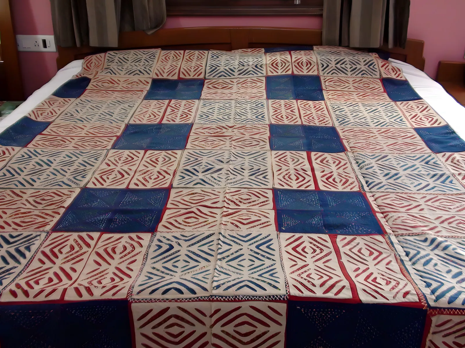 Indigo and madder appliqué bedcover