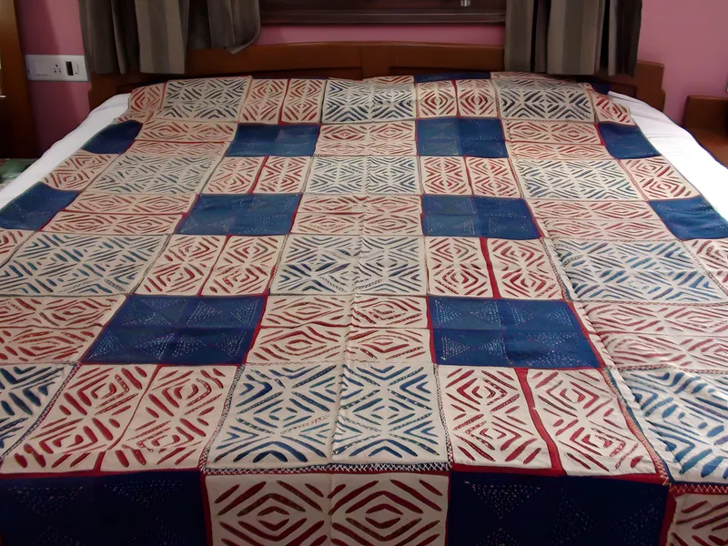 Indigo and madder appliqué bedcover