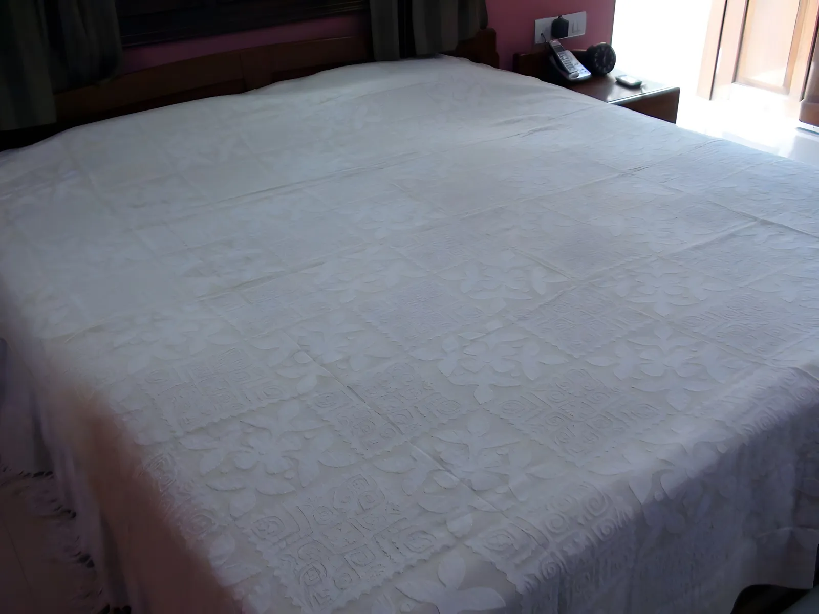 Cutwork bedcover on the bed