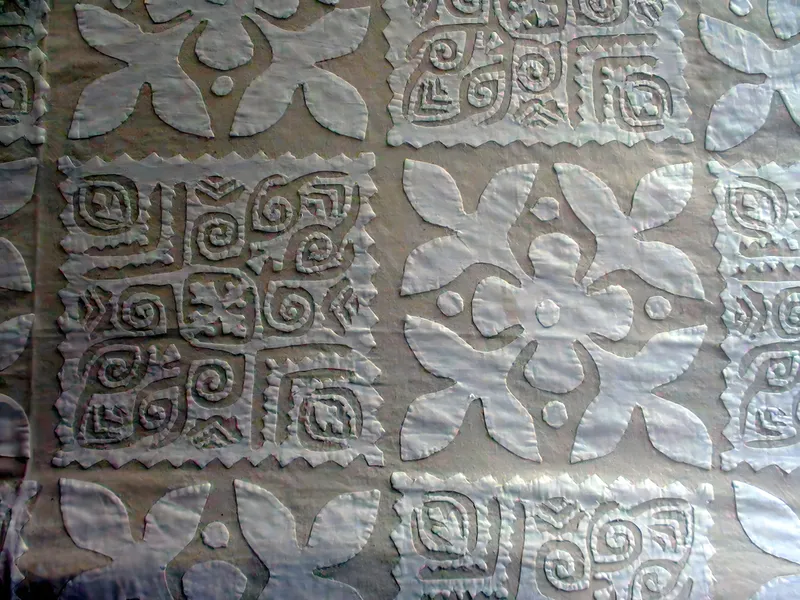 White-on-white cutwork bedcover, detail