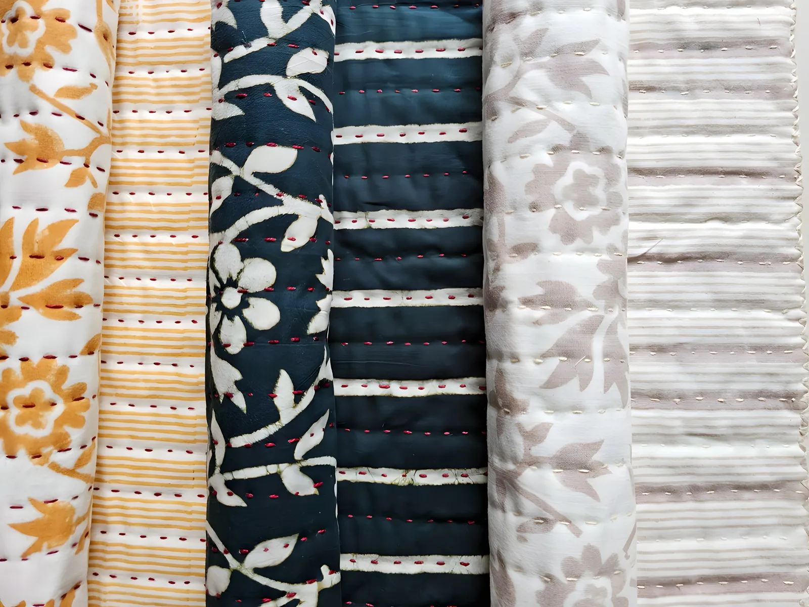 New for 2026: teal, mustard and stone quilts, rolled