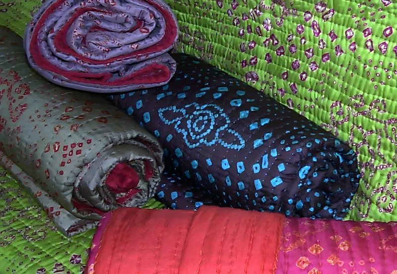 Silk tie-dyed quilts, rolled