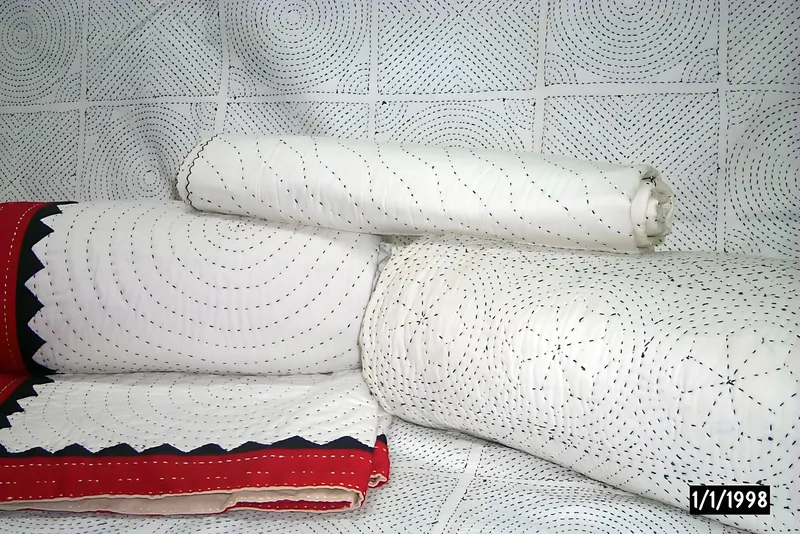 Intricate hand-stitched quilts