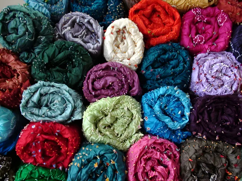 Tie-dye scarves, rolled