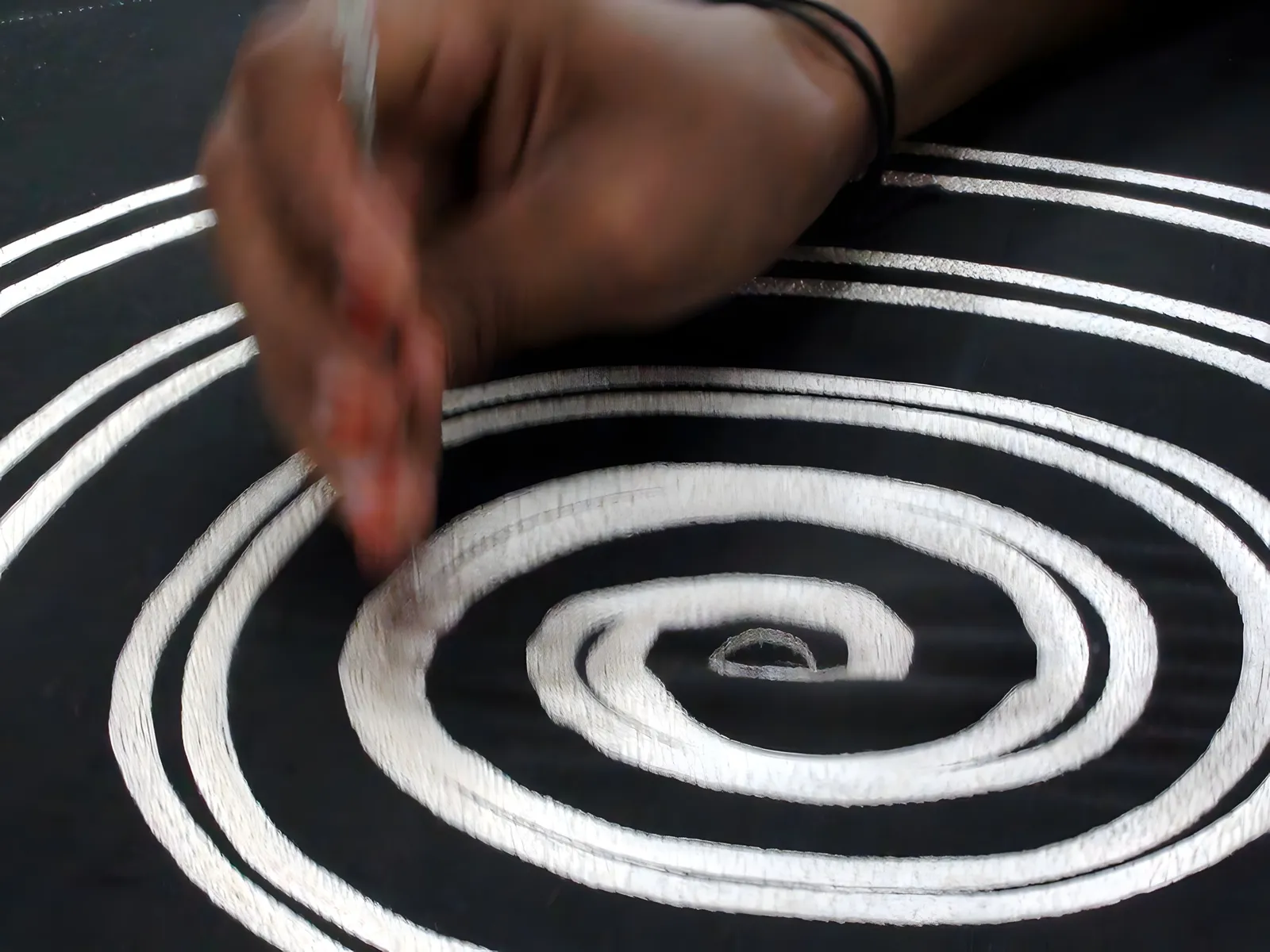 Hand-stitching a spiral appliqué