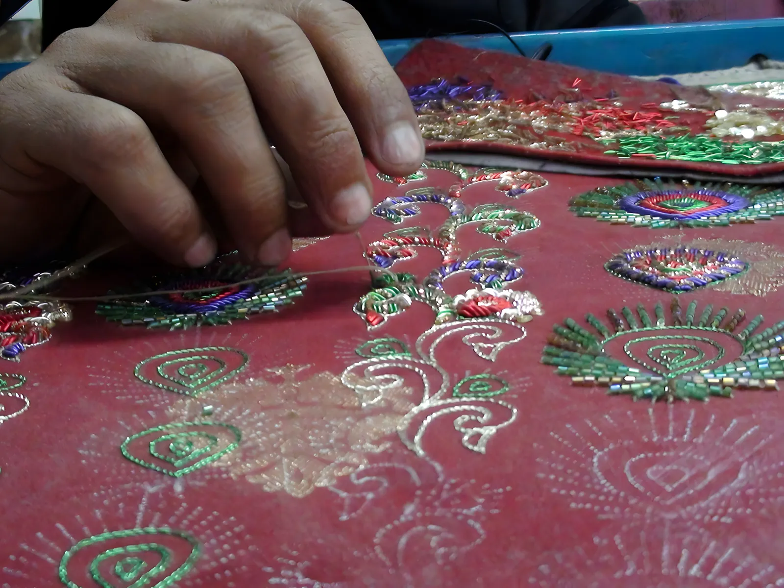 Zardozi embroidery on red silk